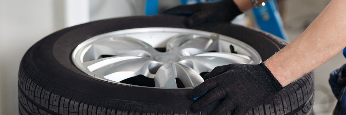 Mechanic holding a tyre - Mobile Tyres St Helens